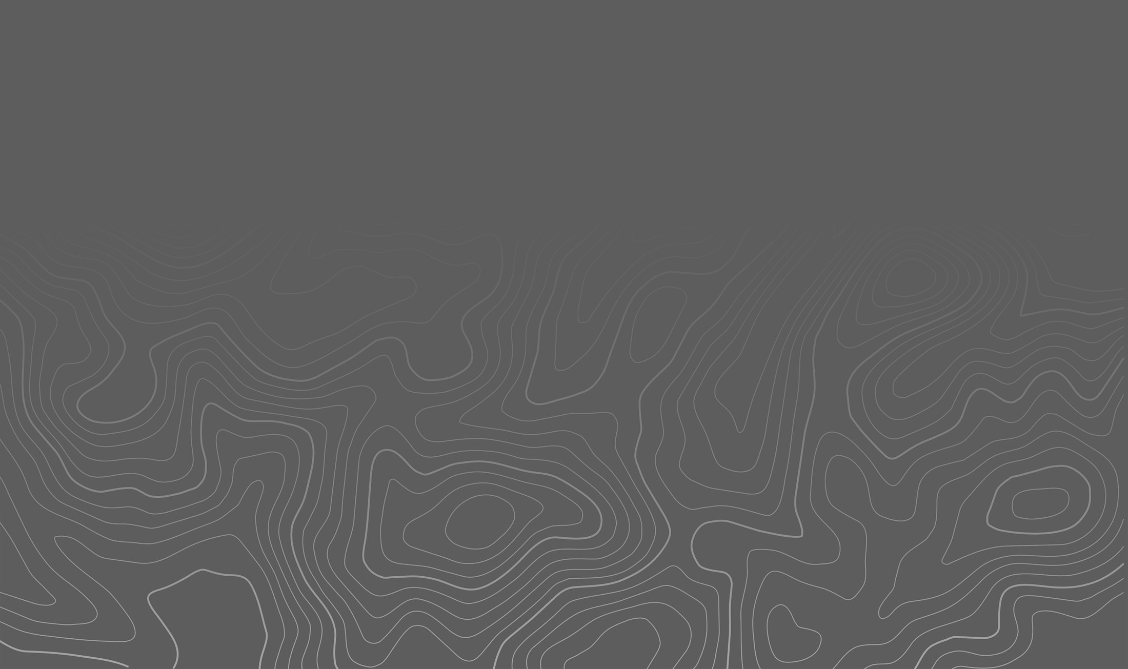 A person wearing a backpack, standing on rocky terrain, gazes at towering, weathered stone formations under a clear blue sky, suggesting an adventure.